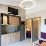 Slide Built-in kitchen open to the living room, fully equipped, in a Premium Bungalow at Camping del Mar 4* in Malgrat de Mar