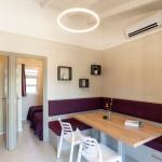 Slide Living room opening onto the two bedrooms that make up the Premium Bungalow at Camping del Mar 4* in Malgrat de Mar