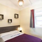 Slide Bright master double bedroom in the Premium Bungalow at Camping del Mar 4* in Malgrat de Mar