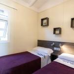 Slide Second bedroom with two single beds, ideal as a children’s room, in the Premium Bungalows at Camping del Mar 4* in Malgrat de Mar