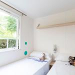 Slide Second bedroom with two single beds, perfect as a children’s room, in a mobile home at Camping del Mar 4* in Malgrat de Mar