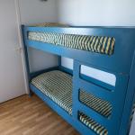 Slide Cabin area with bunk beds in a studio at the Eugénie residence in Biarritz