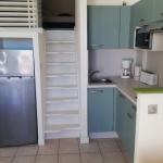 Slide Living area of a studio with a mezzanine and open kitchen at the Eugénie residence in Biarritz