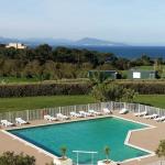 Slide Wide view of the outdoor pool at the Ilbarritz residence with sea view