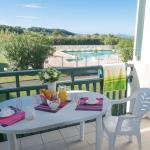 Slide Balcony of an apartment at the Ilbarritz residence in Bidart with pool and sea view