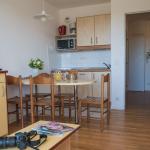 Slide Living room with open kitchen in an Ilbarritz apartment