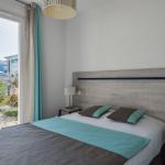 Slide Spacious double bedroom opening onto a private outdoor area in one of the Les Carrelets apartments in Saint-Palais-sur-Mer