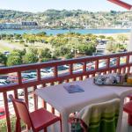 Slide Balcony with outdoor seating overlooking the port from an apartment in the Sokoburu residence