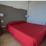 Slide Bedroom with a double bed, wardrobe, and view of the port of Hendaye