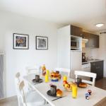 Slide Dining area with fully equipped kitchenette in a cottage at the Domaine de la Baie