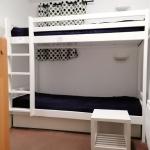 Slide Sleeping area with bunk beds in a cottage at the Domaine de la Baie in Audierne