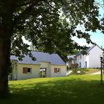 Slide Cottage at the Domaine de la Baie set in a green, landscaped environment