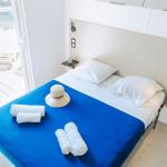 Slide Bedroom with a double bed and included towels in a cottage at Les Places Dorées***** campsite