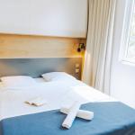Slide Bedroom for two guests with towels included at Les Places Dorées***** campsite