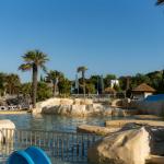 Slide Heated outdoor pool at Les Places Dorées***** campsite