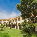 Slide Row of buildings with single-level accommodations offering views over the gardens of the Sognu di Mare residence in Linguizzetta