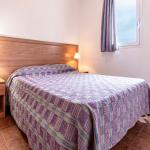 Slide Comfortable and spacious double bedroom in one of the apartments at the Sognu Di Rena residence in Moriani-Plage