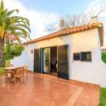 Slide Villa within the Pedras del Rei residence in Portugal with a large private terrace in front of the entrance