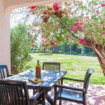 Slide Private terrace overlooking the gardens of the Pedras del Rei residence in Portugal with outdoor furniture