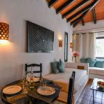 Slide Dining and living area in a villa within the Pedras da Rainha residence, Portugal