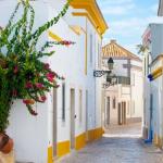 Slide White alleyway in the town of Tavira, southern Portugal