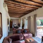 Slide Spacious living room in traditional style, opening onto the large terrace at Villa Dar Wellness
