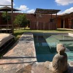 Slide Balinese-style décor around the swimming pool at Villa Dar Wellness