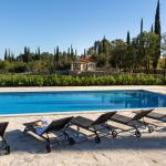 Slide Exclusive properties in Croatia featuring two cottages and a shared 100 m² swimming pool