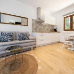 Slide Living room and fully equipped kitchen area at the Sveta Ana Lodges cottages in Croatia