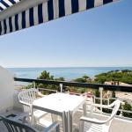 Slide Balcony in the superior apartments of the Do Parque residence, featuring outdoor furniture and sea views in Olhos d’Água