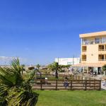 Slide Exterior façade of the Neptune residence with direct access to the beach.