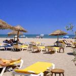 Slide Beach in Occitanie with sun loungers.