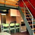 Slide Duplex at Résidence Vorey-sur-Arzon with dining area and staircase leading to the upper floor