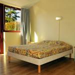 Slide Double bedroom in a cottage at Résidence Vorey-sur-Arzon with access to the outdoor terrace