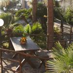 Slide Communal area with tropical garden at the Baia d’Oro residence in Sicily