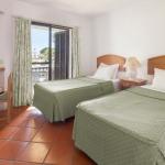 Slide Sleeping area with a twin bedroom in the standard accommodations at Balaia Golf Village