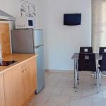 Slide Open-plan kitchen leading into the living area of a Superior apartment at Résidence Le Saint Estève in La Ciotat