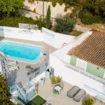 Slide Heated outdoor swimming pool with sun loungers at Résidence Le Saint Estève