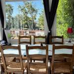 Slide Dining room with outdoor views for large families at Maison La Folie