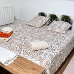 Slide Second basement bedroom with a double bed at Maison La Folie Marseille