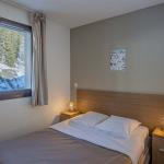 Slide Chambre avec lit double dans les appartements Terrasses de Veret à Flaine