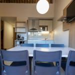 Slide Living room of an apartment at Paese Serenu Residence with dining area and fully equipped open-plan kitchen