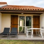 Slide Terrace with outdoor furniture at a six-person cottage at Le Hameau de Vouvant