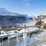 Slide Snow-covered balcony with a view of the mountains at the Les Terrasses de Veret residence