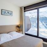 Slide Chambre avec lit double dans les appartements Terrasses de Veret à Flaine