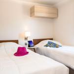 Slide Chambre avce lits simples dans un cottage VIP au village vacances les Muriers