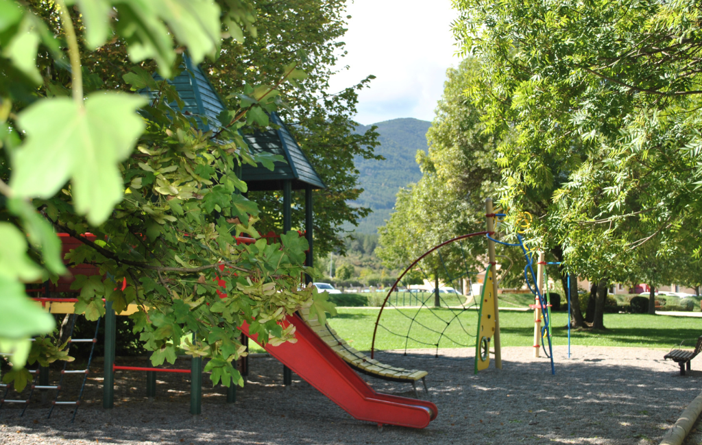 Slide Children's playground in the small park near the Le Hameau des Sources by Ateya residence in Montbrun