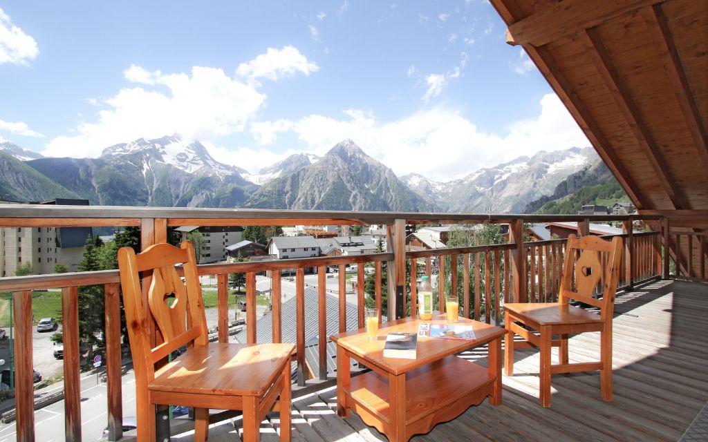 Slide balcony with beautiful views of the mountains from the Deux Alpes resort at the L'Ours Blanc residence