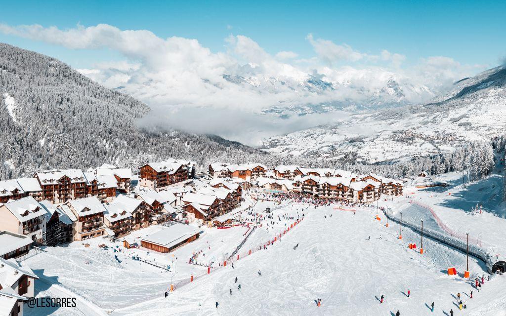 Slide View of Les Orres 1800 resort in the mountains in winter