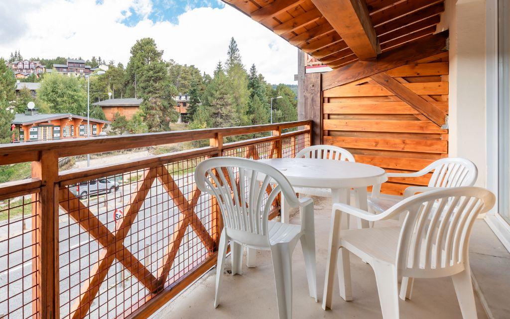 Slide View from a balcony of an apartment in the Pyrénées 2000 residence under the summer sun